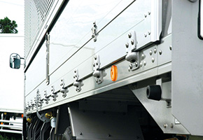 Hinged drop sides for loading onto trucks